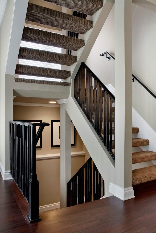 Example of a transitional carpeted u-shaped open staircase design in Detroit