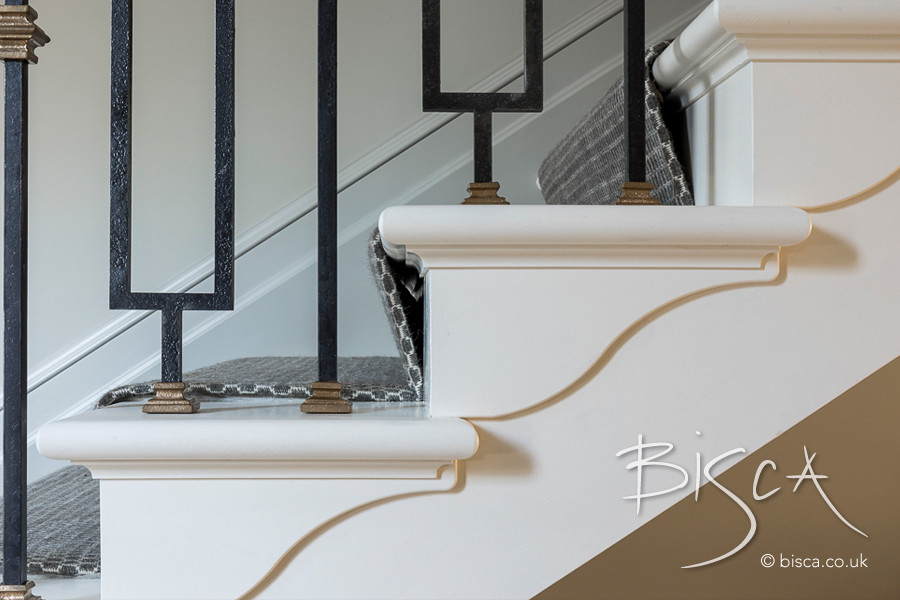 Inspiration for a large classic metal railing staircase in Surrey.