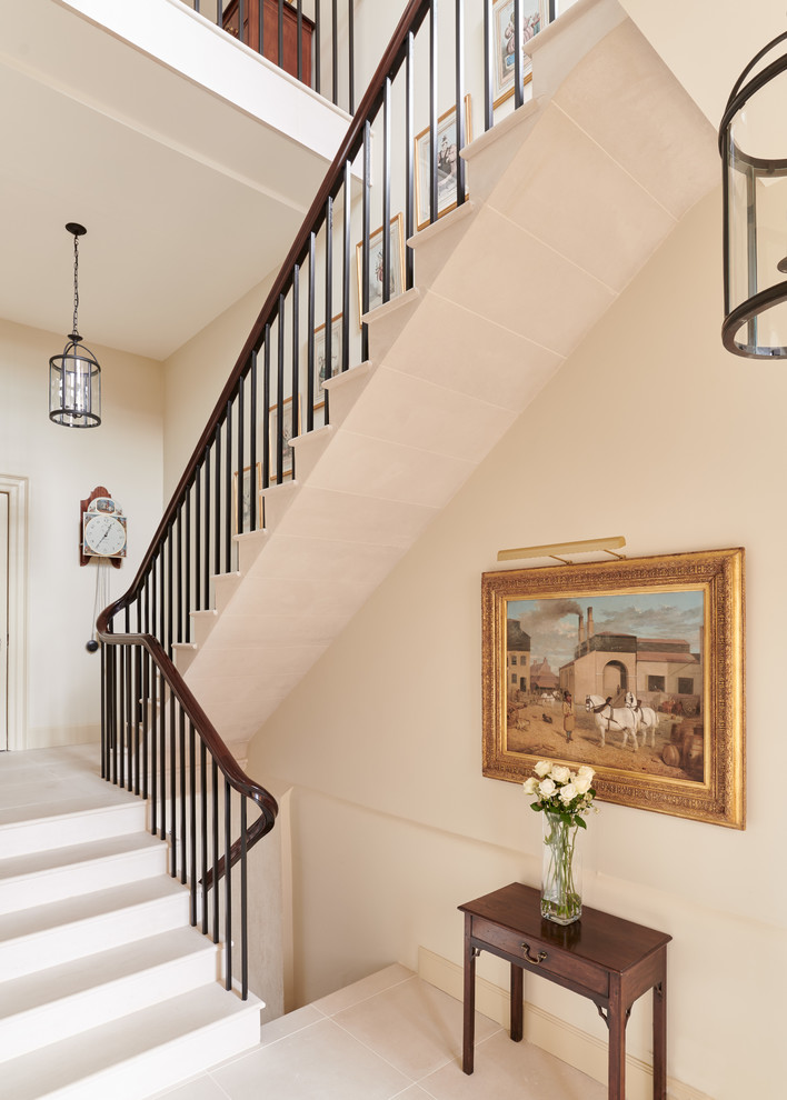 This is an example of a traditional l-shaped metal railing staircase in Other.