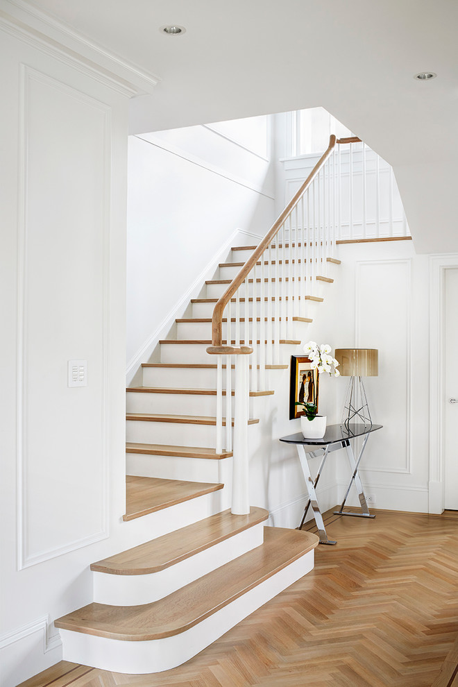 Design ideas for a medium sized traditional wood l-shaped staircase in Vancouver with painted wood risers.