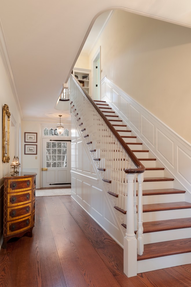 Photo of a traditional wood staircase in Philadelphia with painted wood risers.