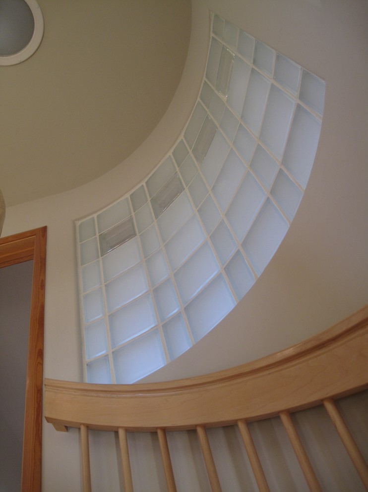 Inspiration for a small world-inspired wood spiral staircase in San Francisco with open risers.