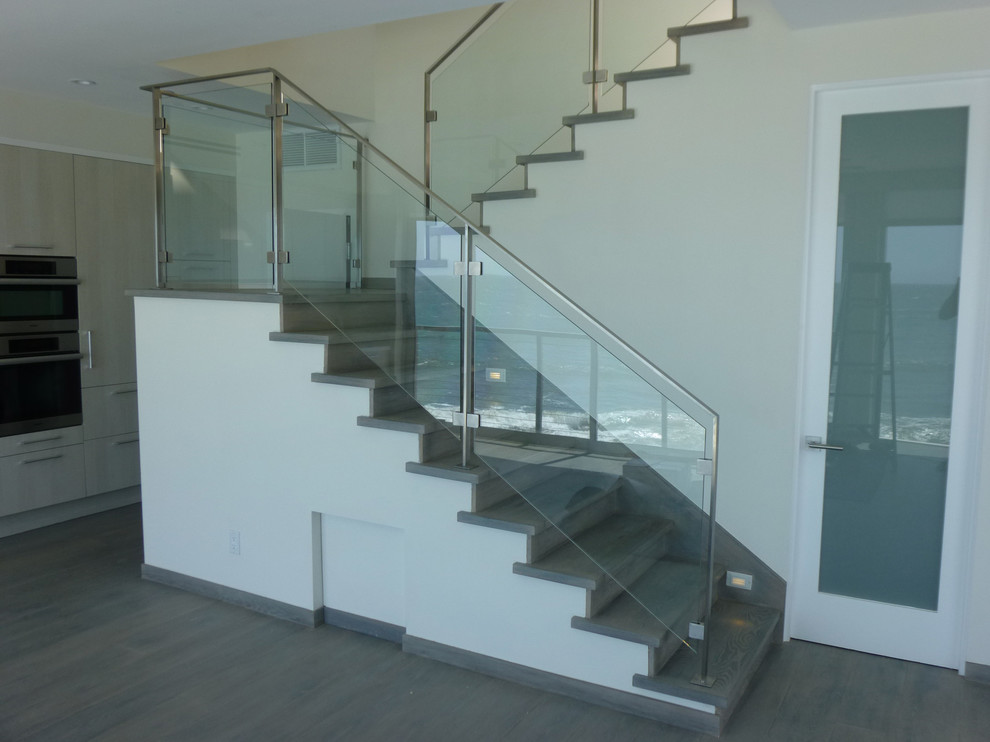 Photo of a contemporary wood u-shaped staircase in Los Angeles with wood risers.