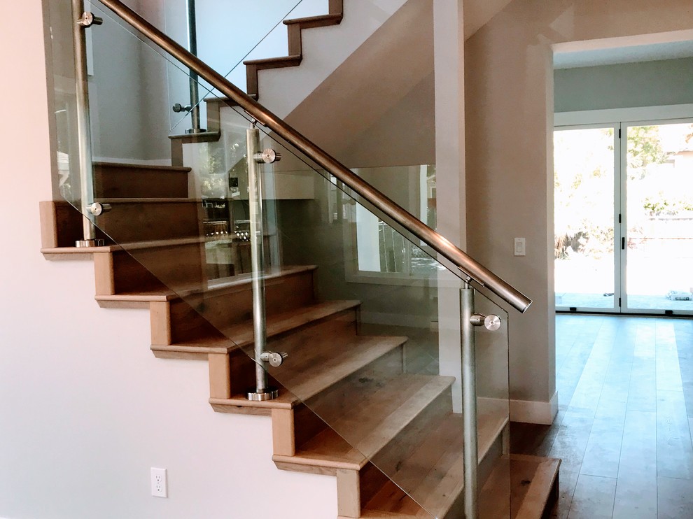 Staircase - mid-sized contemporary wooden u-shaped glass railing staircase idea in San Francisco with wooden risers