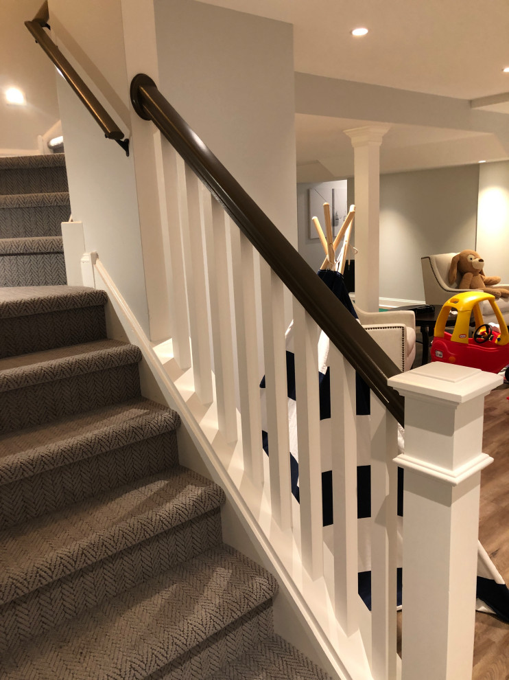 Staircase - large modern carpeted l-shaped wood railing staircase idea in Philadelphia with carpeted risers