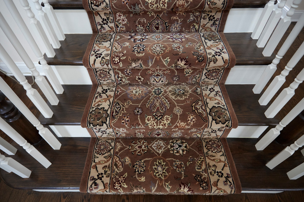 Inspiration for a large timeless carpeted l-shaped wood railing staircase remodel in Chicago with painted risers