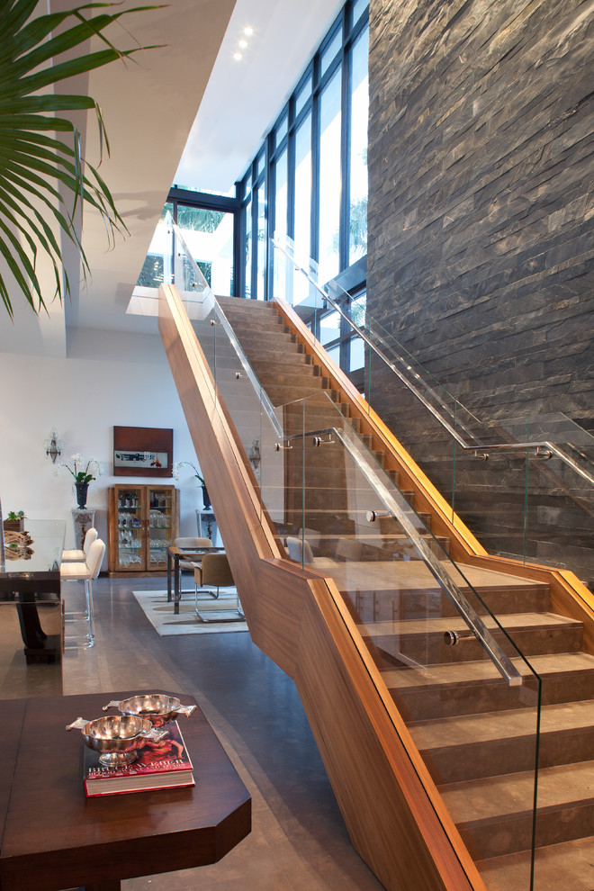 This is an example of a contemporary straight staircase in Miami.