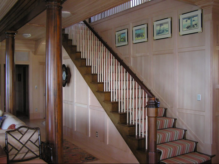 Example of a large classic wooden straight staircase design in Other with wooden risers