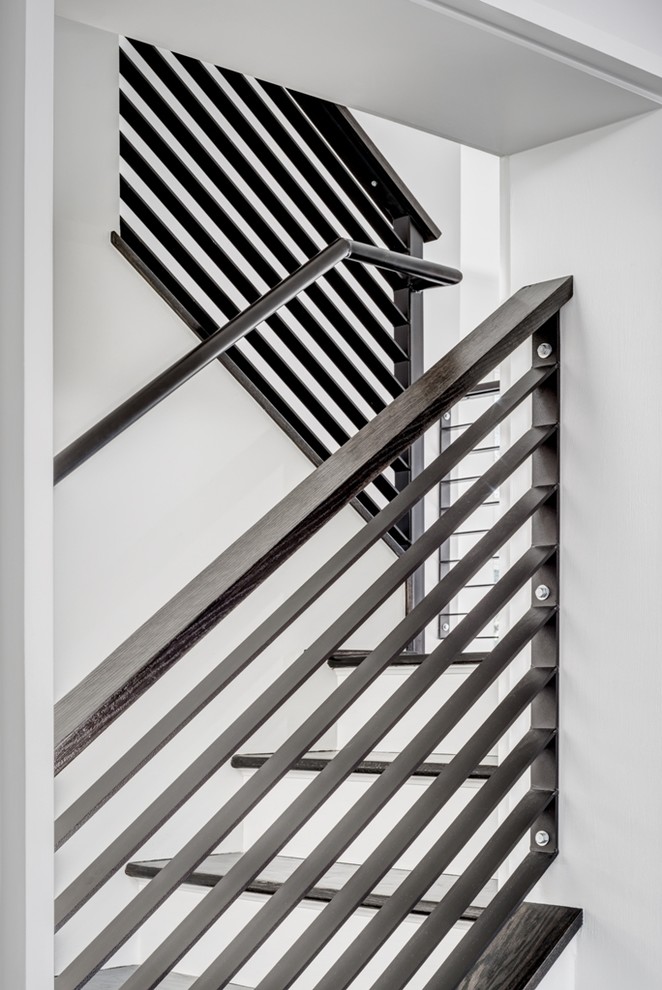 Exemple d'un escalier peint tendance en L avec des marches en bois.
