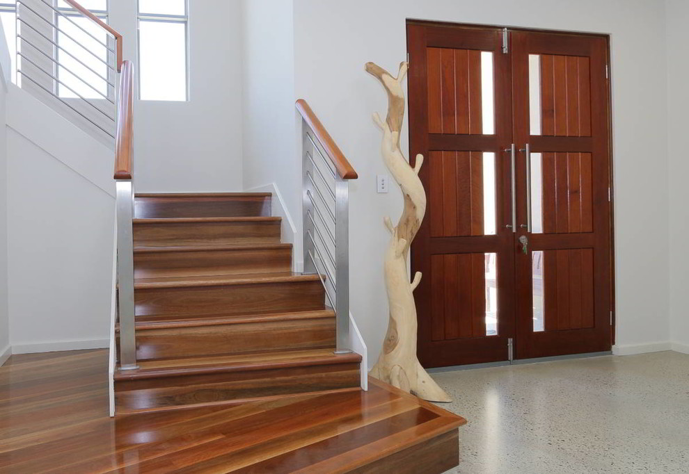 This is an example of a medium sized contemporary wood l-shaped metal railing staircase in Perth with wood risers.