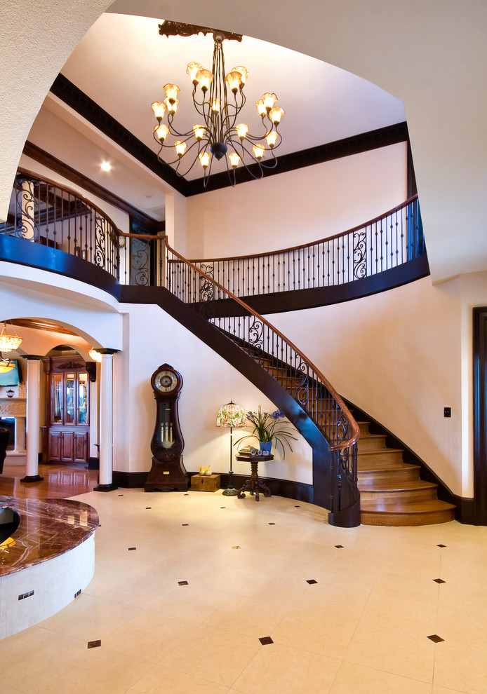 Inspiration for a large timeless wooden curved staircase remodel in Charleston with wooden risers