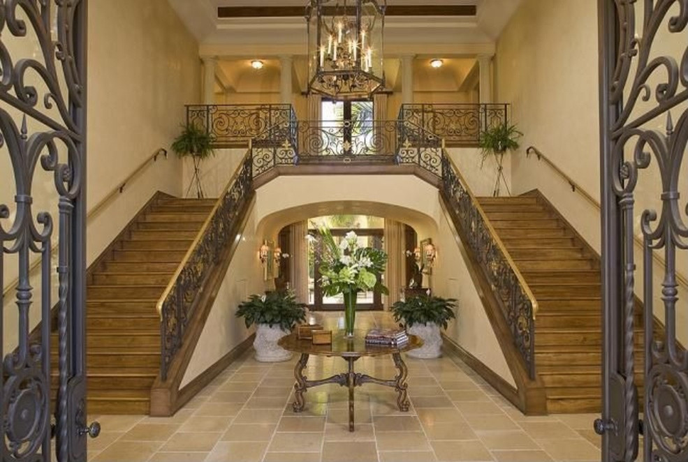 Design ideas for an expansive mediterranean wood straight metal railing staircase in Other with wood risers.