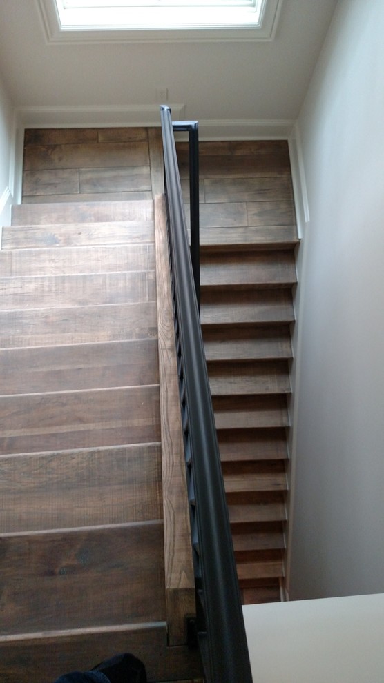 Design ideas for a medium sized mediterranean wood straight staircase in Houston with wood risers.