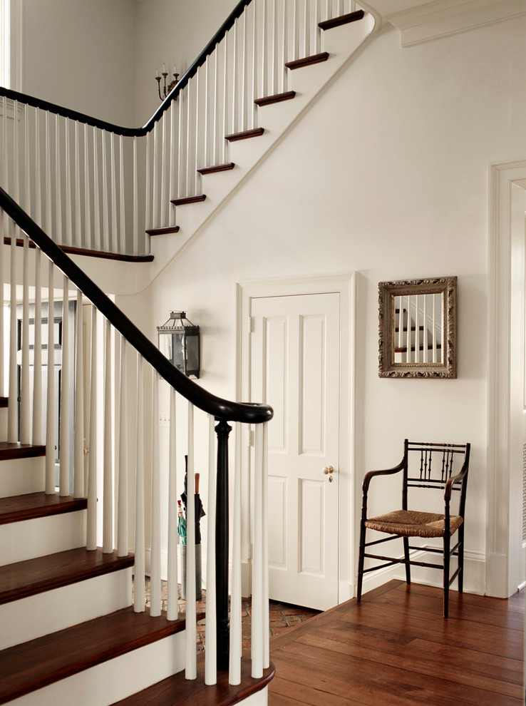 Example of a mid-sized classic wooden curved staircase design in DC Metro with wooden risers