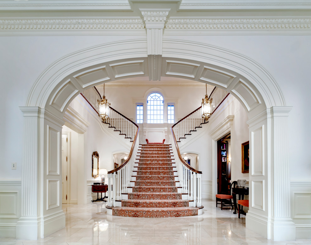 Large classic wood l-shaped wood railing staircase in Dallas with painted wood risers.