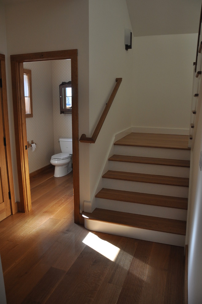 Staircase - large traditional wooden u-shaped staircase idea in New York with wooden risers