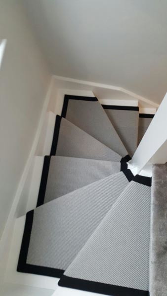 This is an example of a medium sized classic carpeted u-shaped mixed railing staircase in London.