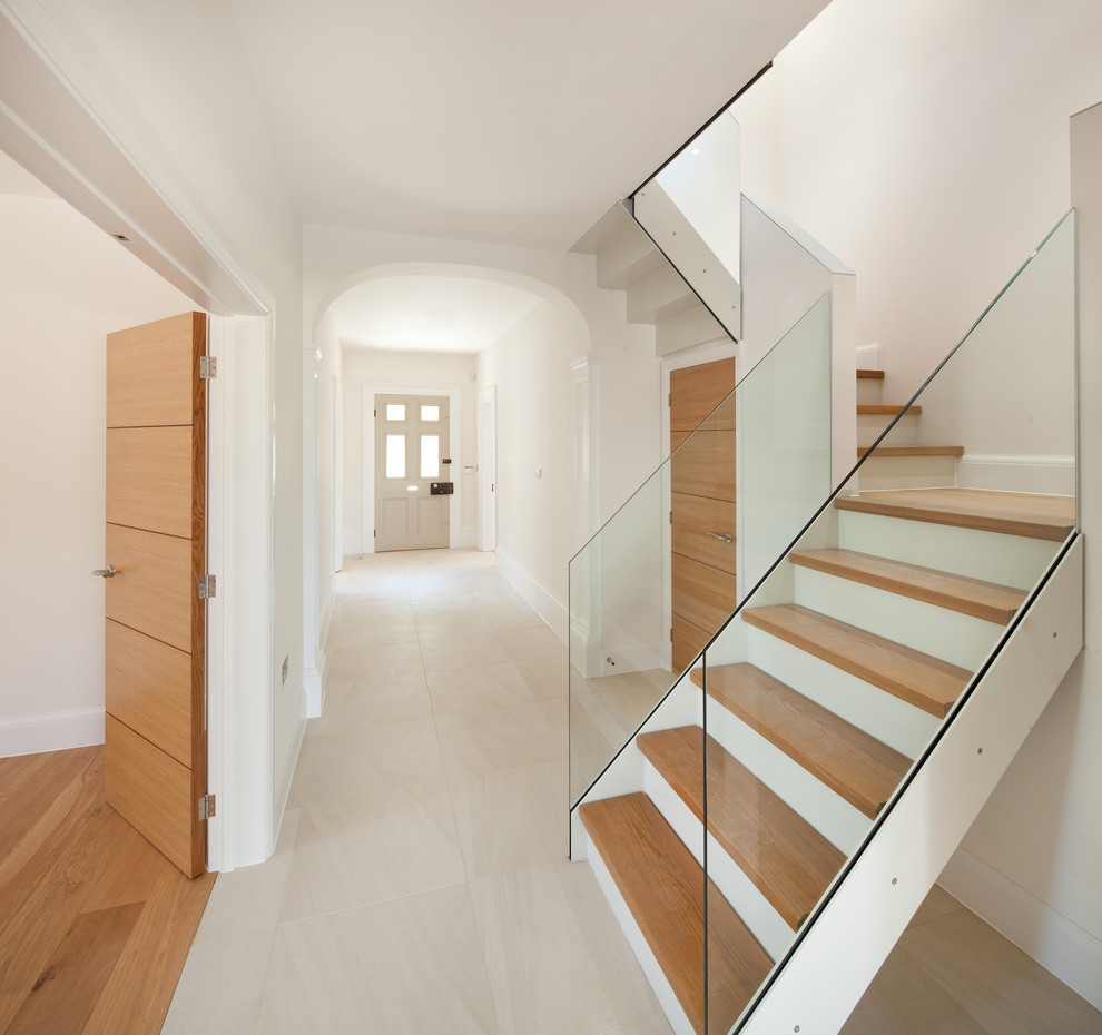 Photo of a large contemporary wood l-shaped staircase in Oxfordshire.