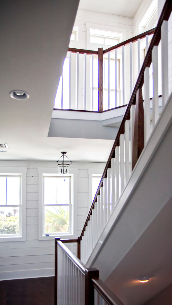 Inspiration for a coastal staircase in Jacksonville with feature lighting.