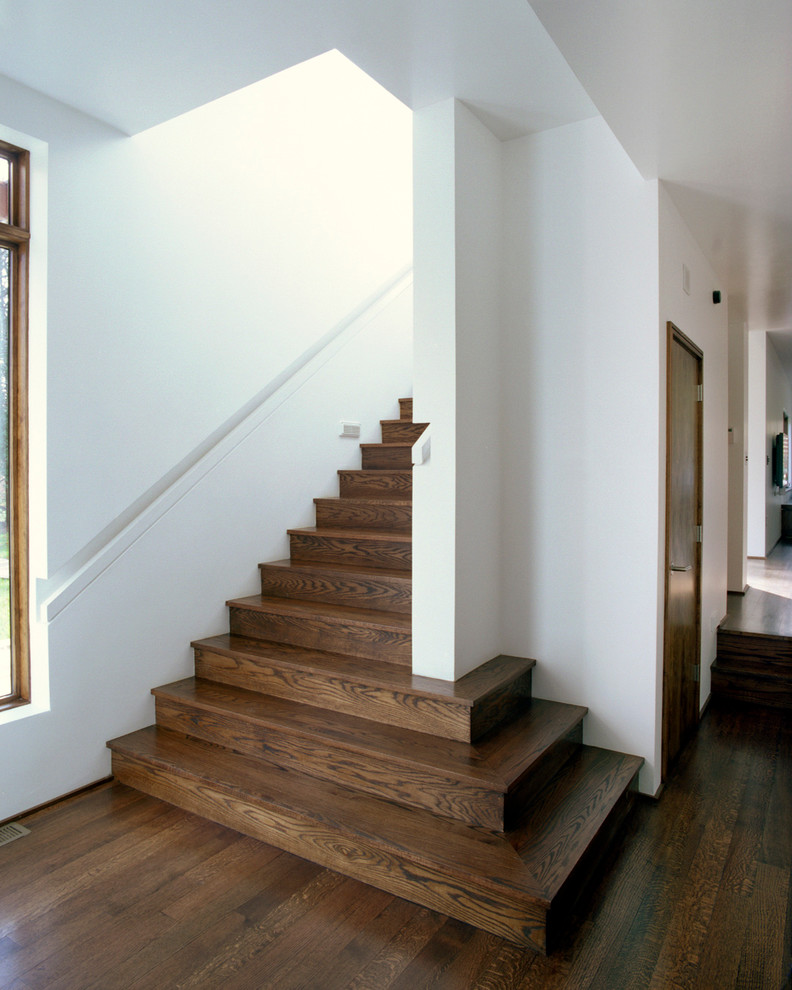 Photo of a medium sized modern wood straight staircase in Boston with wood risers.