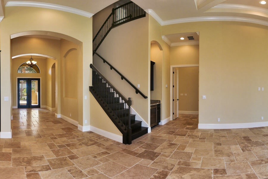 Example of a tuscan wooden l-shaped staircase design in Miami with wooden risers