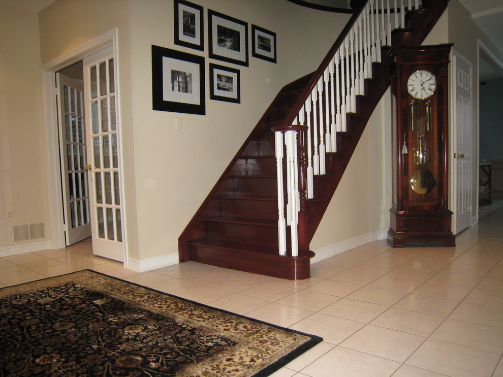 Example of a classic wooden staircase design in Toronto with wooden risers