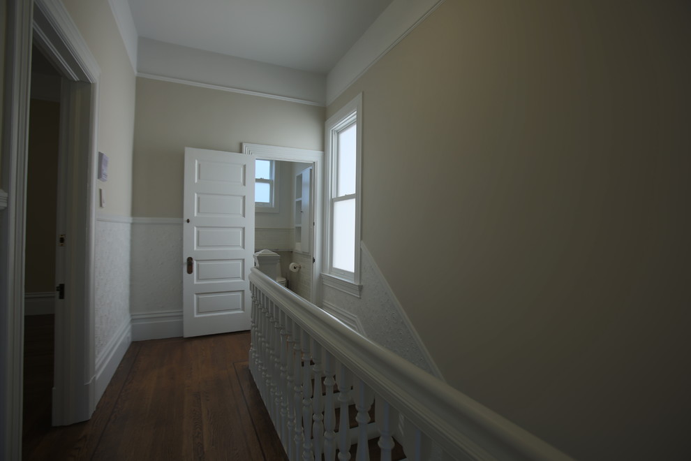 Example of a mid-sized arts and crafts wooden straight staircase design in San Francisco with painted risers
