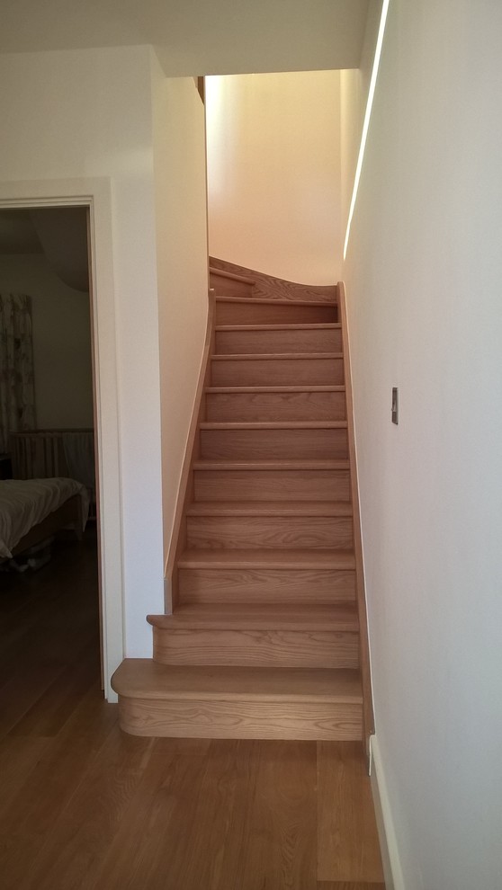 Inspiration for a large contemporary wood floating staircase in London.