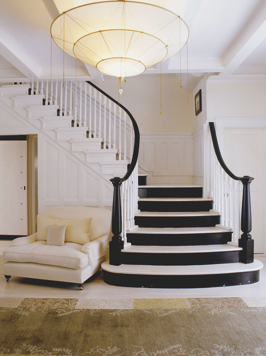 Exemple d'un escalier peint courbe tendance de taille moyenne avec des marches en bois peint.