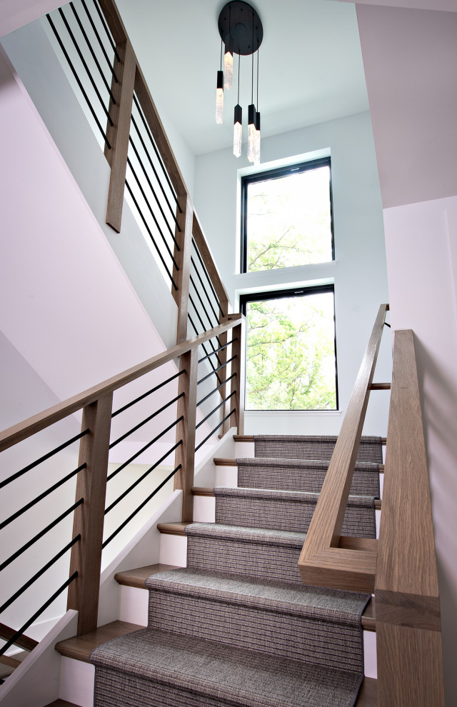 Inspiration for a cottage carpeted mixed material railing staircase remodel in Chicago
