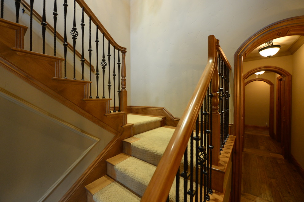 Traditional wood u-shaped staircase in San Francisco with wood risers.