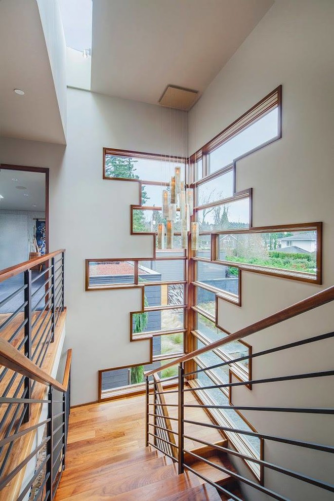 Imagen de escalera en U contemporánea con escalones de madera
