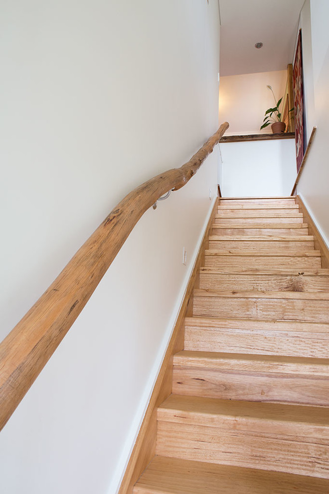 Small contemporary wood straight staircase in Wollongong with wood risers.