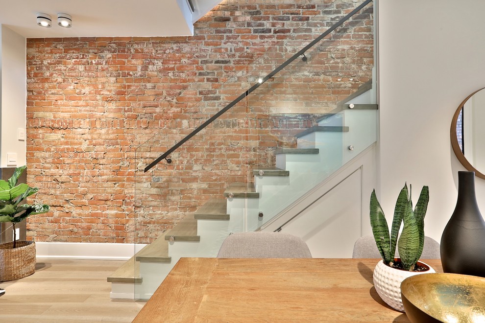 Photo of a modern staircase in Toronto with feature lighting.