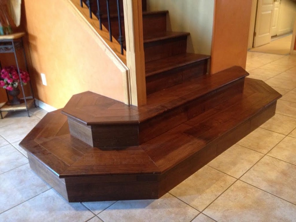 Staircase - small traditional wooden straight metal railing staircase idea in Los Angeles with wooden risers