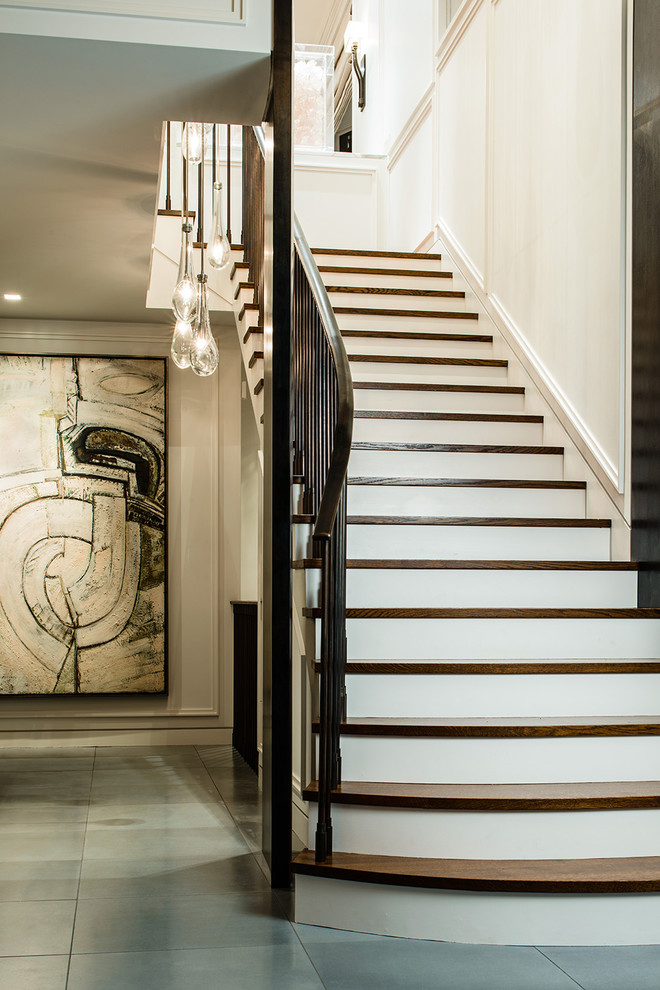 Example of a transitional wooden straight staircase design in Seattle with painted risers