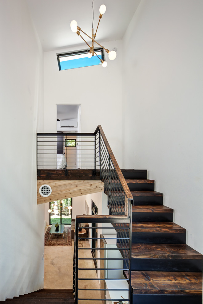 Staircase - small contemporary wooden straight staircase idea in Austin with metal risers