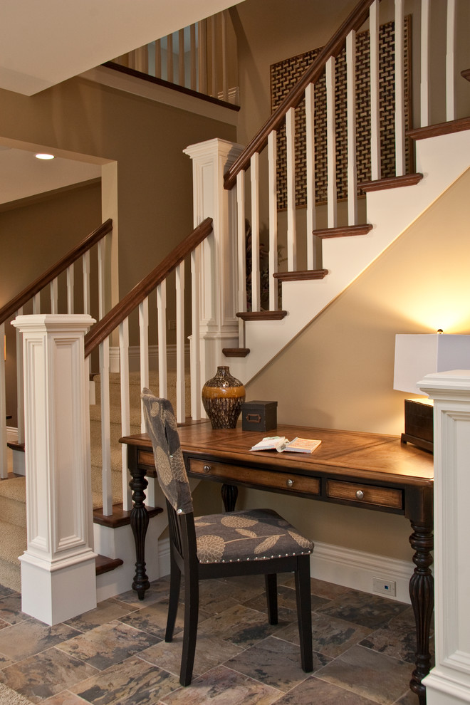 Inspiration for a large timeless wooden l-shaped staircase remodel in Grand Rapids with painted risers