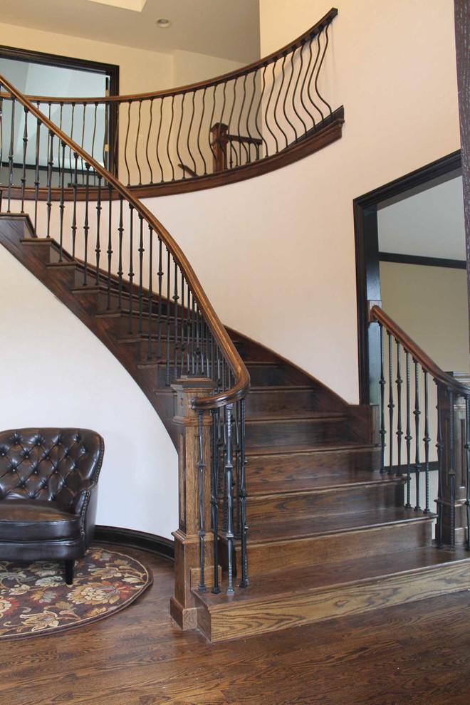 Inspiration for a mid-sized timeless wooden curved staircase remodel in Chicago with wooden risers