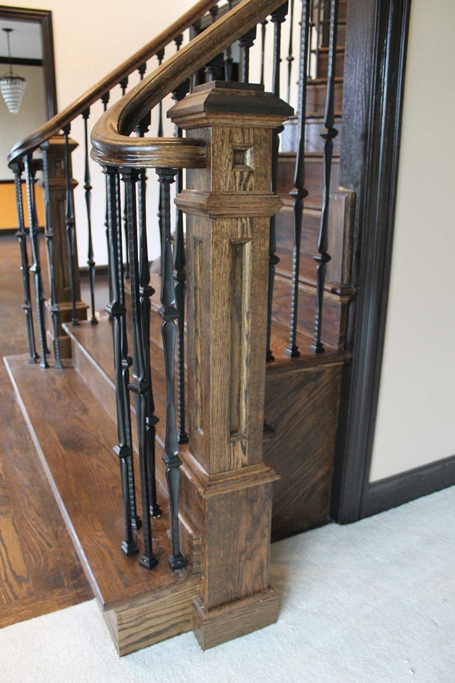 Inspiration for a mid-sized timeless wooden curved staircase remodel in Chicago with wooden risers