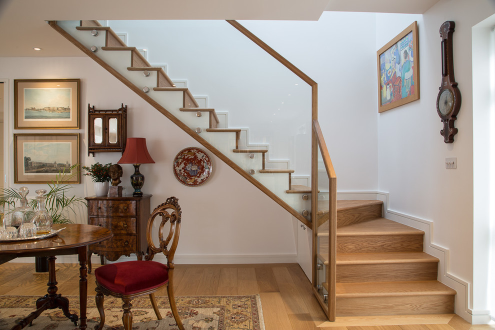 Photo of a classic staircase in London with feature lighting.