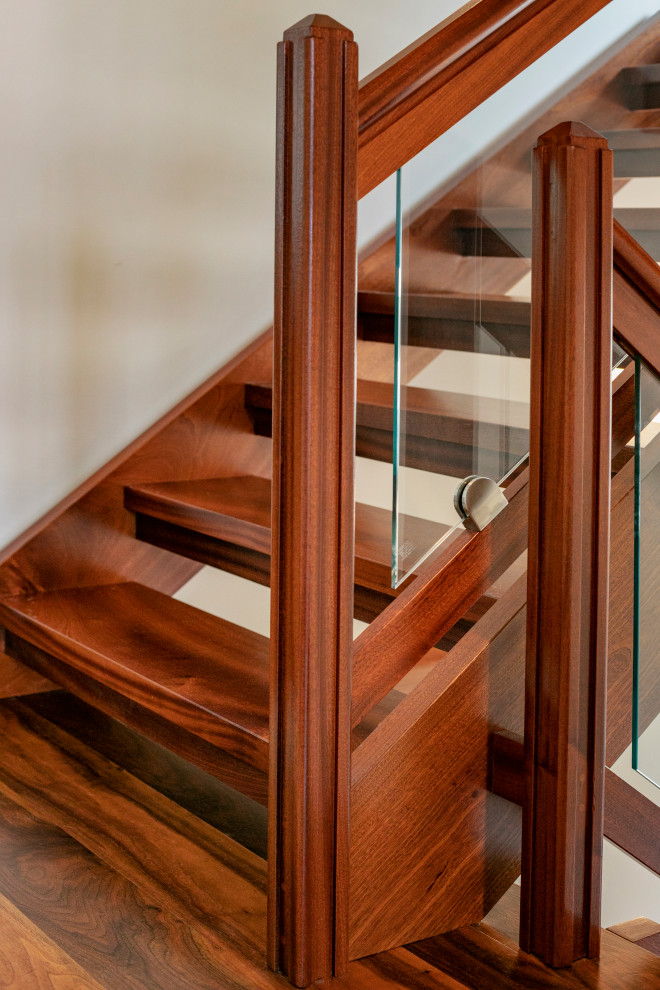 Large trendy wooden u-shaped open and glass railing staircase photo in Portland Maine