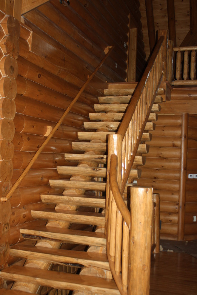 Exemple d'un escalier sans contremarche droit montagne de taille moyenne avec des marches en bois et un garde-corps en bois.