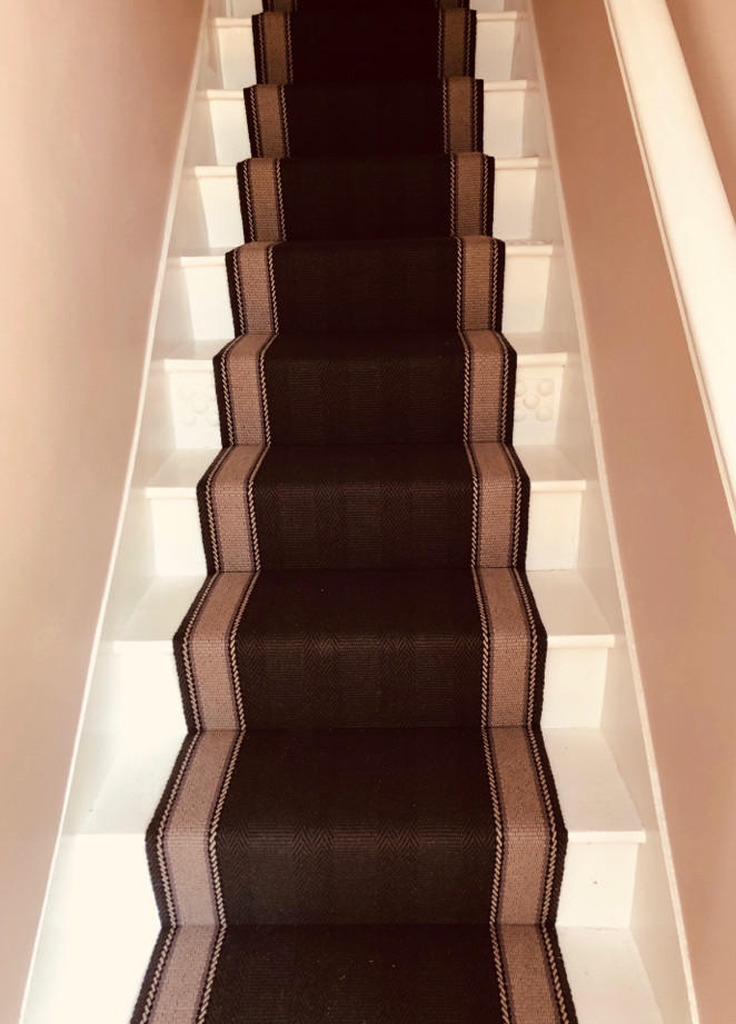 Example of a trendy wood railing staircase design in Hertfordshire