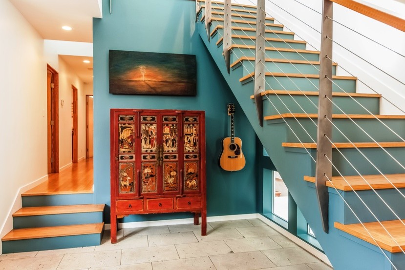 Staircase - mid-sized southwestern wooden straight staircase idea in Los Angeles with painted risers