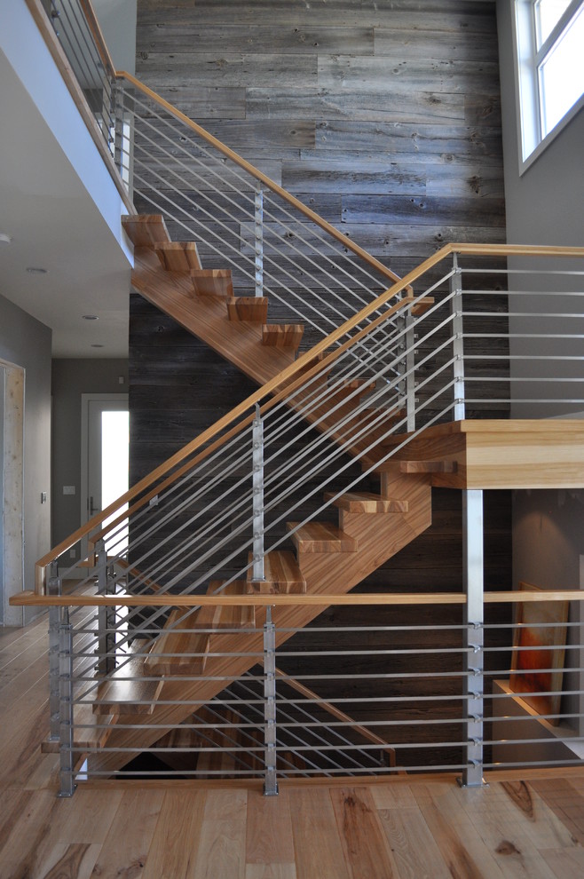 Inspiration for a mid-sized contemporary wooden u-shaped staircase remodel in Edmonton with wooden risers