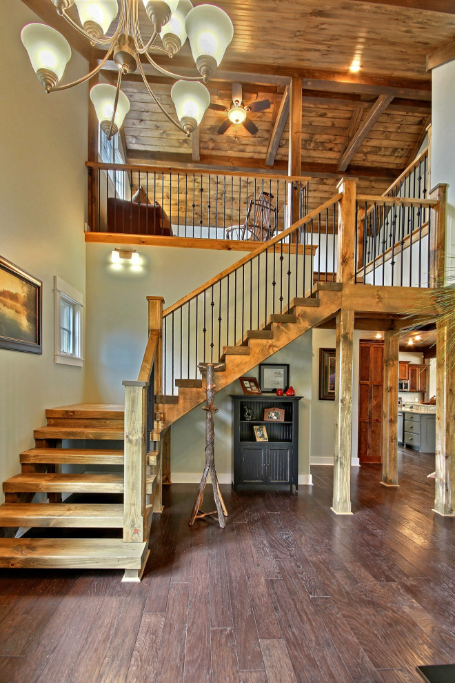Inspiration for a medium sized classic wood floating mixed railing staircase in Atlanta with open risers.