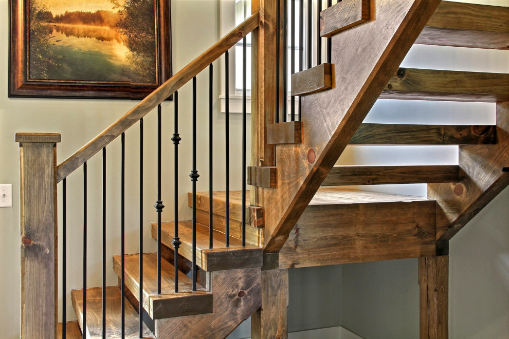 Inspiration pour un escalier sans contremarche flottant craftsman de taille moyenne avec des marches en bois et un garde-corps en matériaux mixtes.