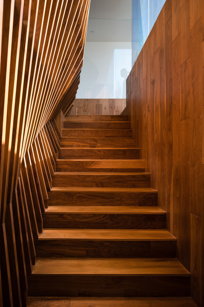 This is an example of a modern wood staircase in Los Angeles with wood risers.