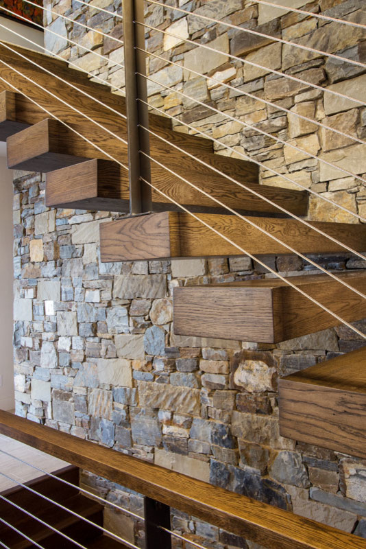This is an example of a medium sized traditional wood straight staircase in Salt Lake City with open risers.